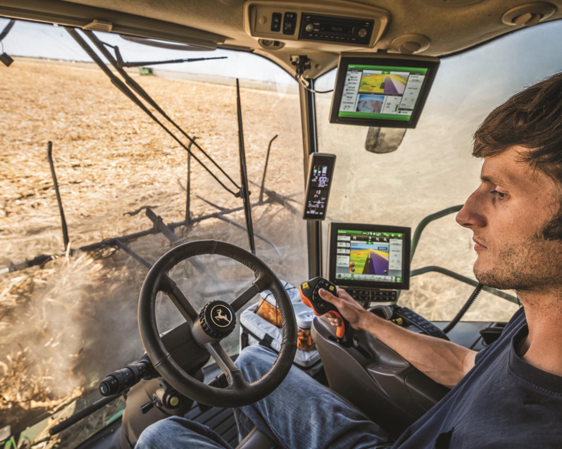 An equipment operator uses GPS to navigate a field.