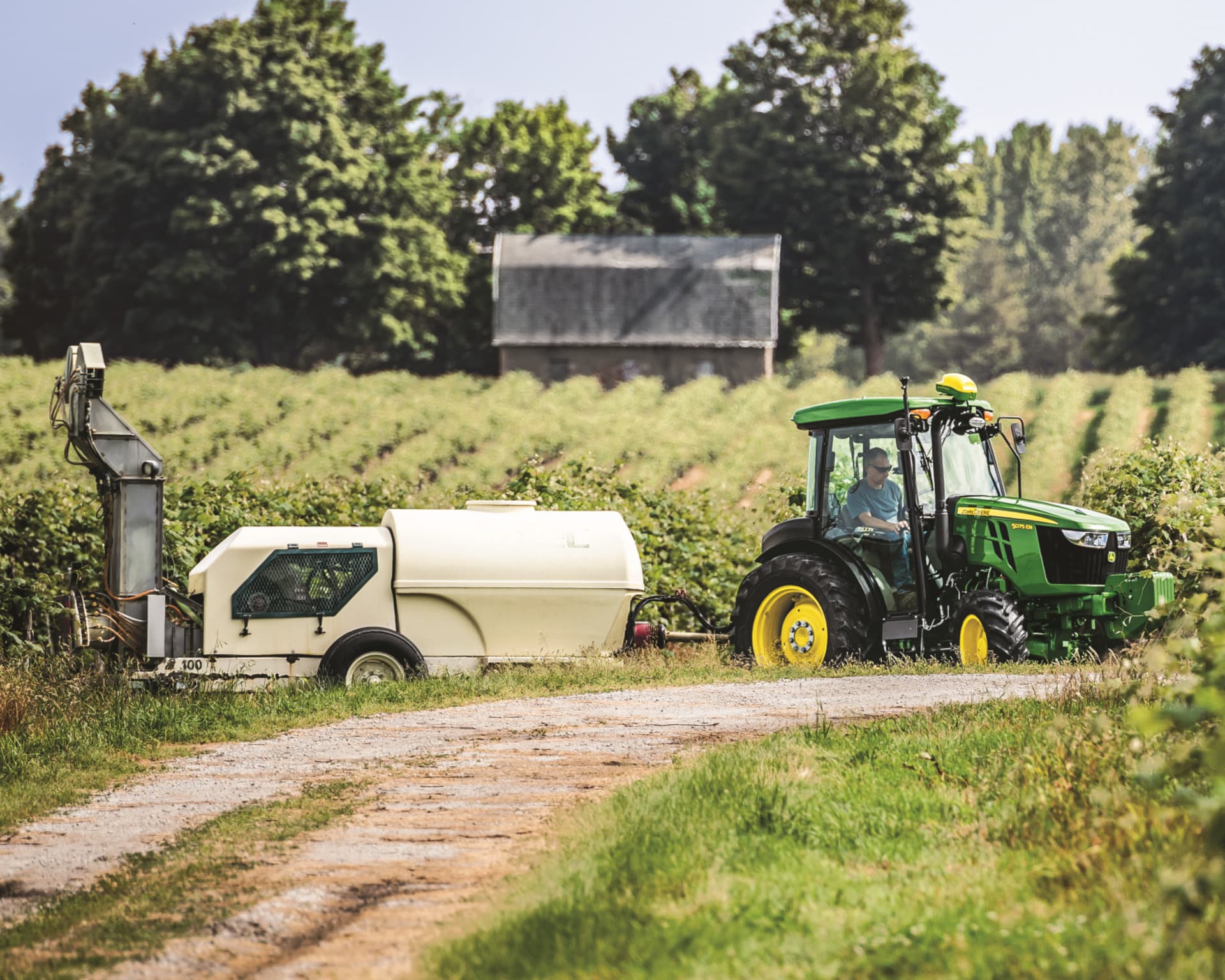 A John Deere 5075EN tractor sprays crops in California.