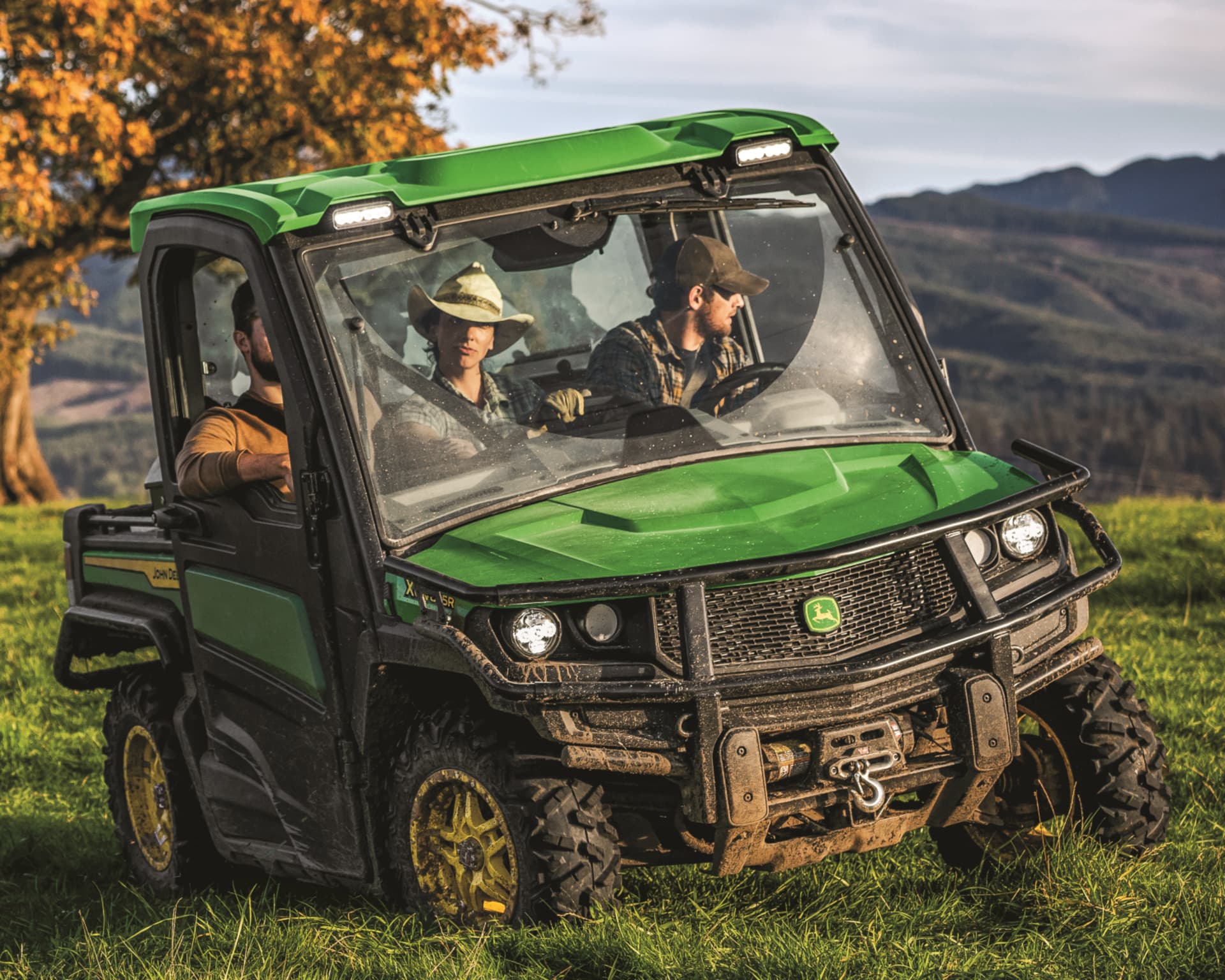 Workers take a ride in a Gator on a California property.