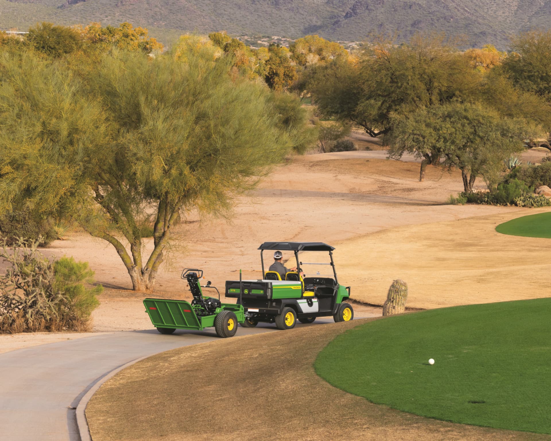 A worker on a California golf course works during the winter months to maintain the quality of the green.