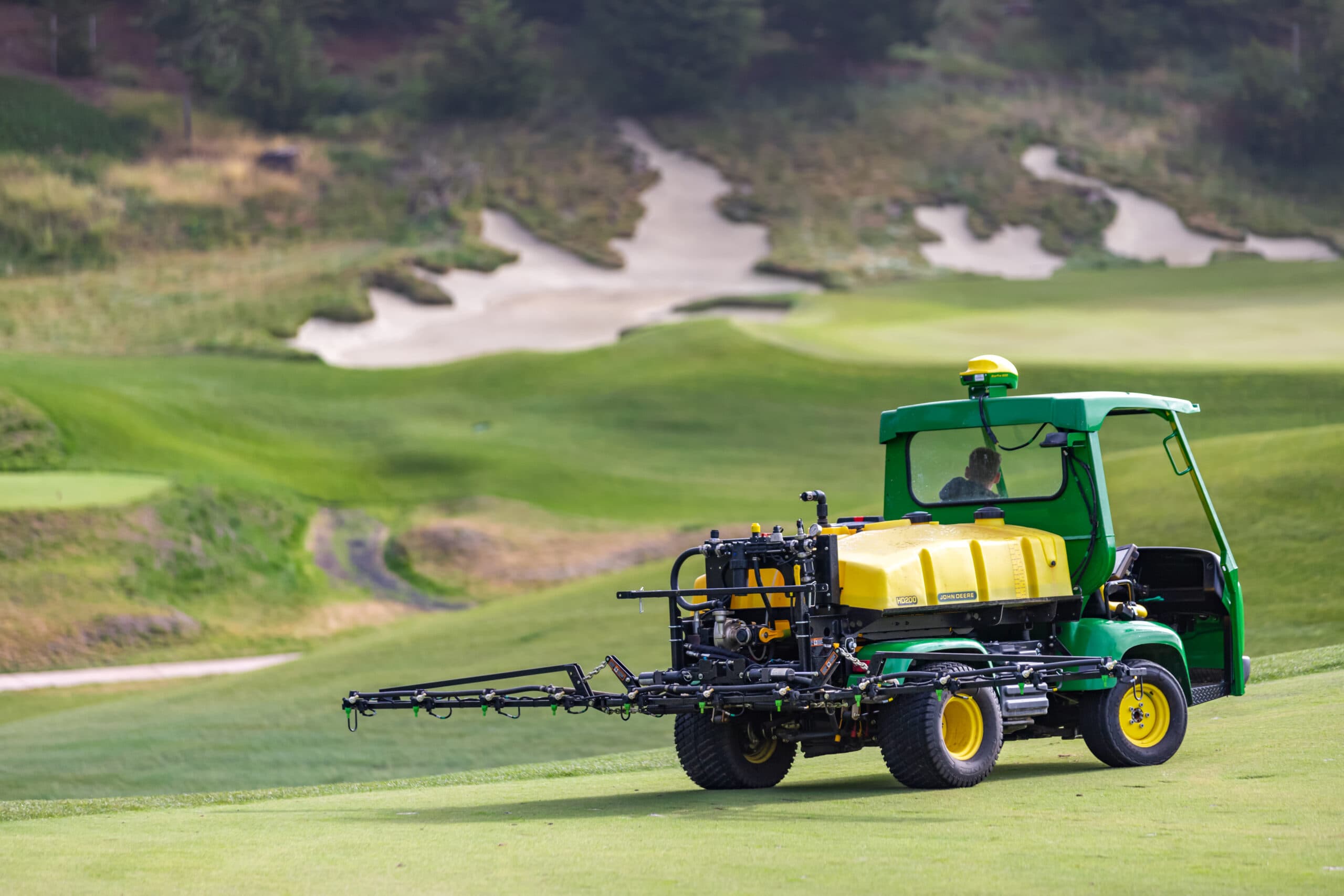 A John Deere ProGator Precision Golf Sprayer sprays a golf course in California.