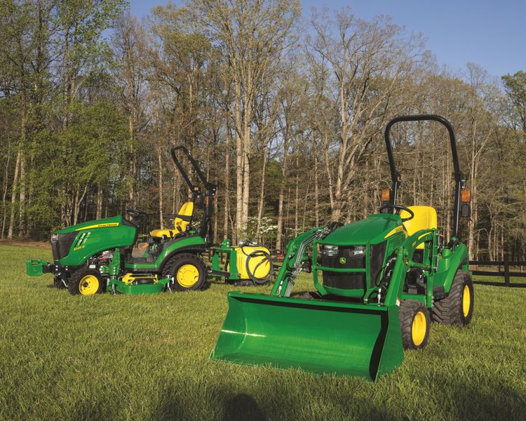 A group shot of two John Deere 2025R compact trctors.