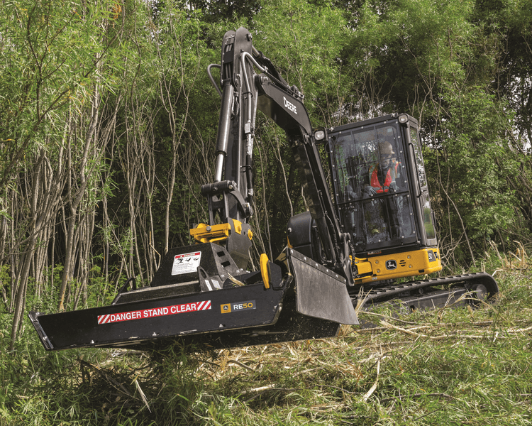A compact excavator takes care of work on a job site in California.