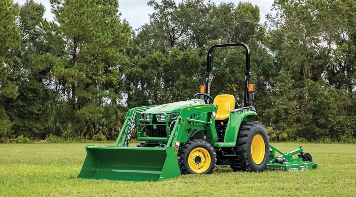 A John Deere 3025E in a field in California.